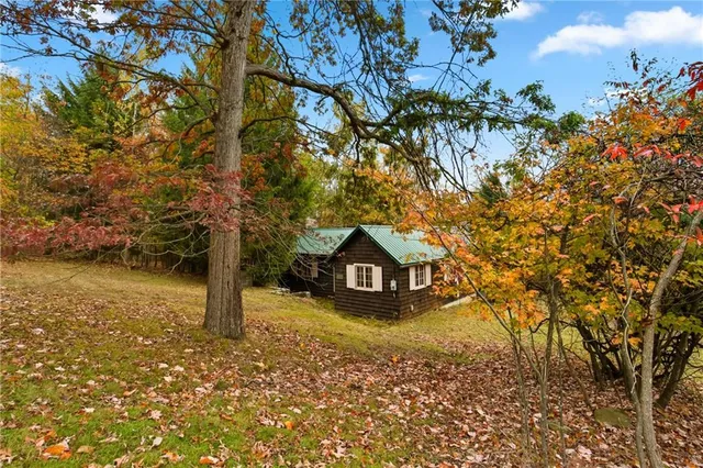 a house with trees in front of it