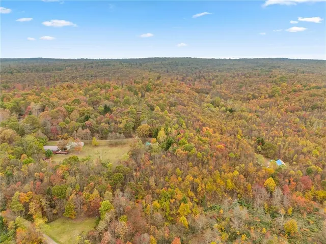 a view of a lake with houses in the back