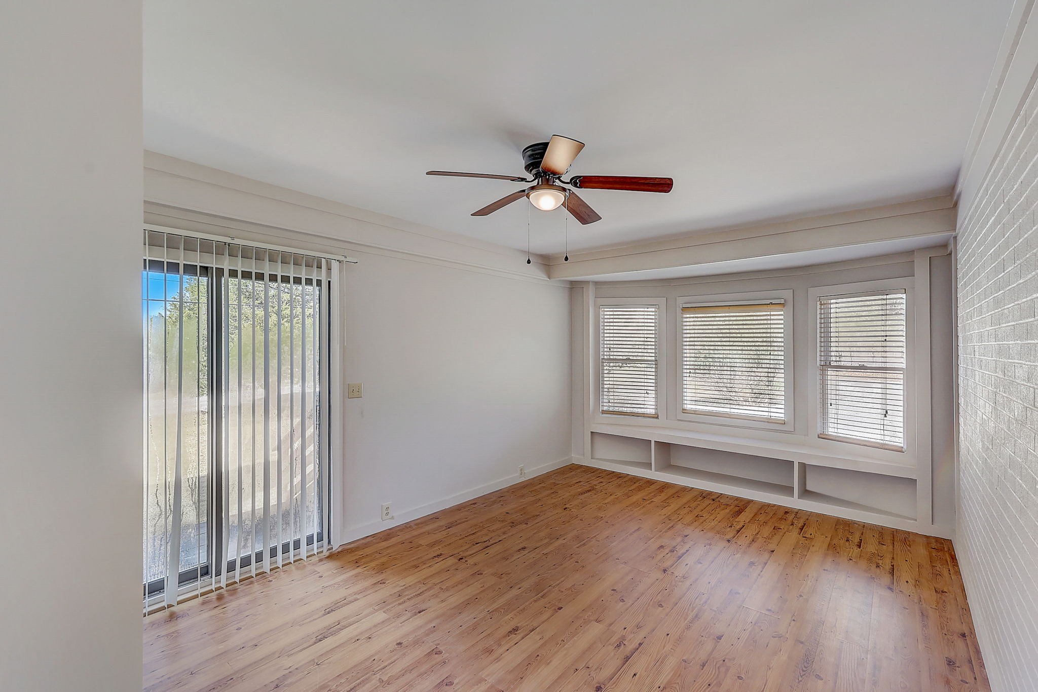 280 Dean Road Clarksville, TN 37040 - Photo 16 of 33 an empty room with wooden floor and windows