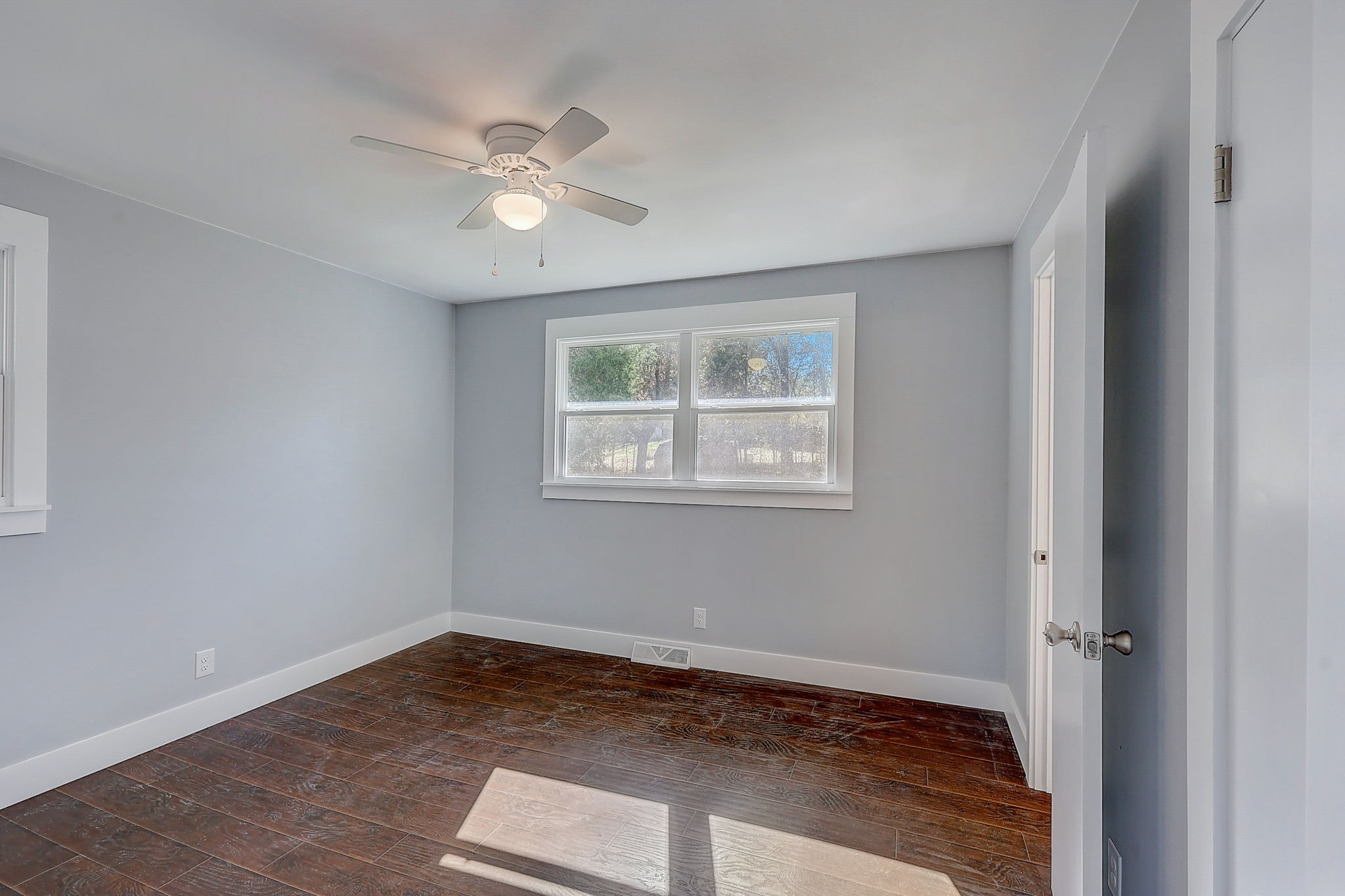 280 Dean Road Clarksville, TN 37040 - Photo 23 of 33 a view of an empty room with wooden floor and a window