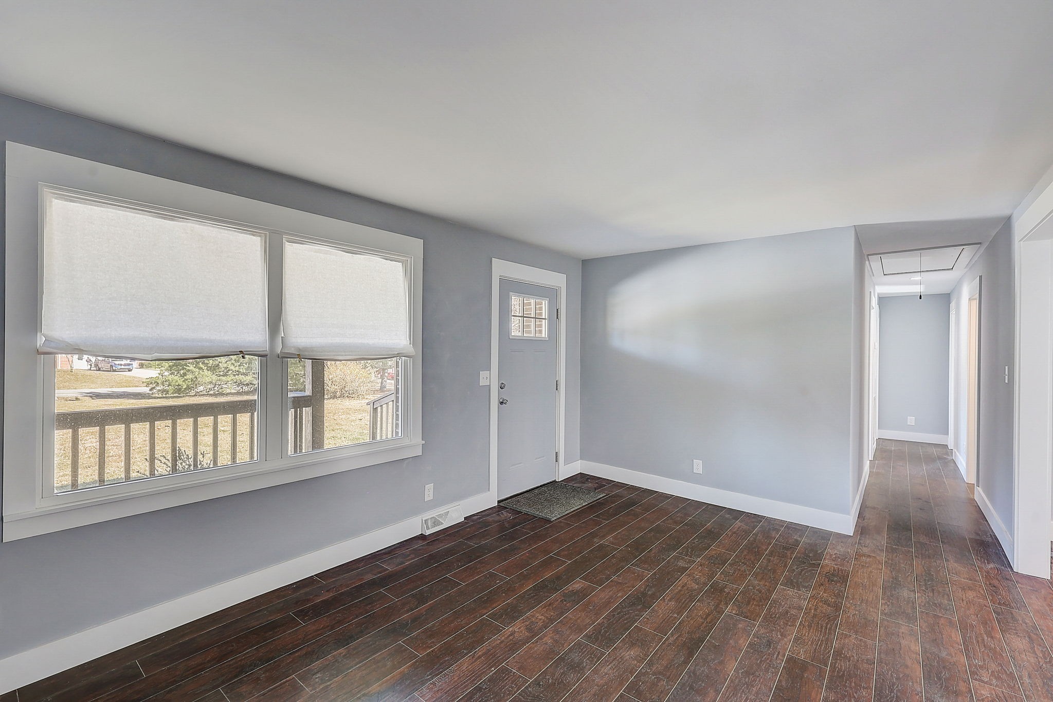 280 Dean Road Clarksville, TN 37040 - Photo 6 of 33 an empty room with wooden floor and windows