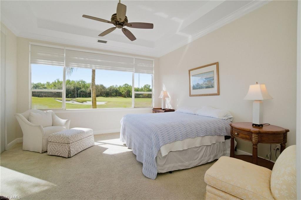 17015 Porta Vecchio Way, Unit 101 Naples, FL 34110 - Photo 22 of 39 a bedroom with a bed and a couch
