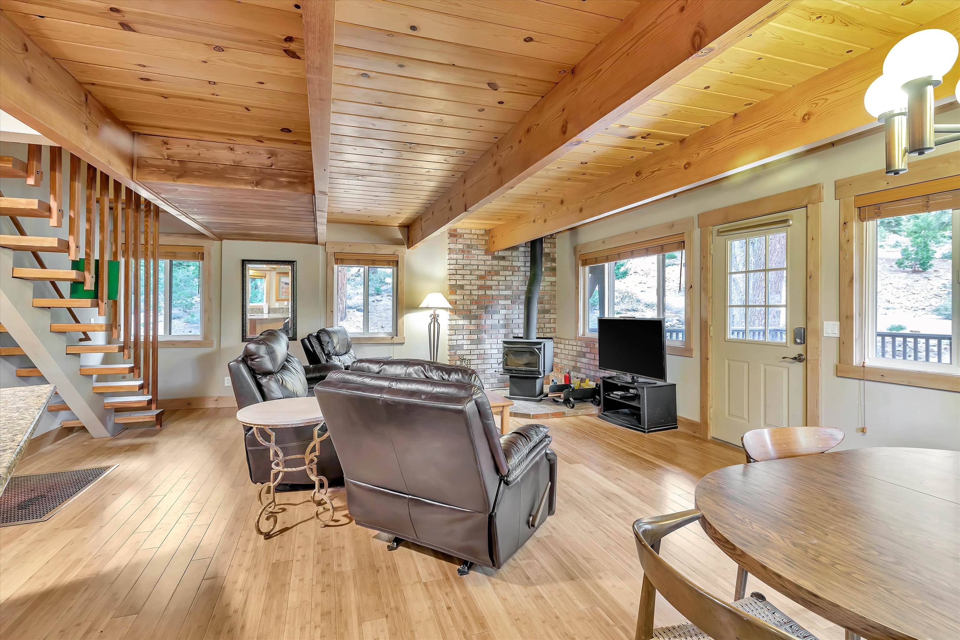 505 Granite Road Carnelian Bay, CA 96140 - Photo 6 of 20 a living room with furniture and a flat screen tv