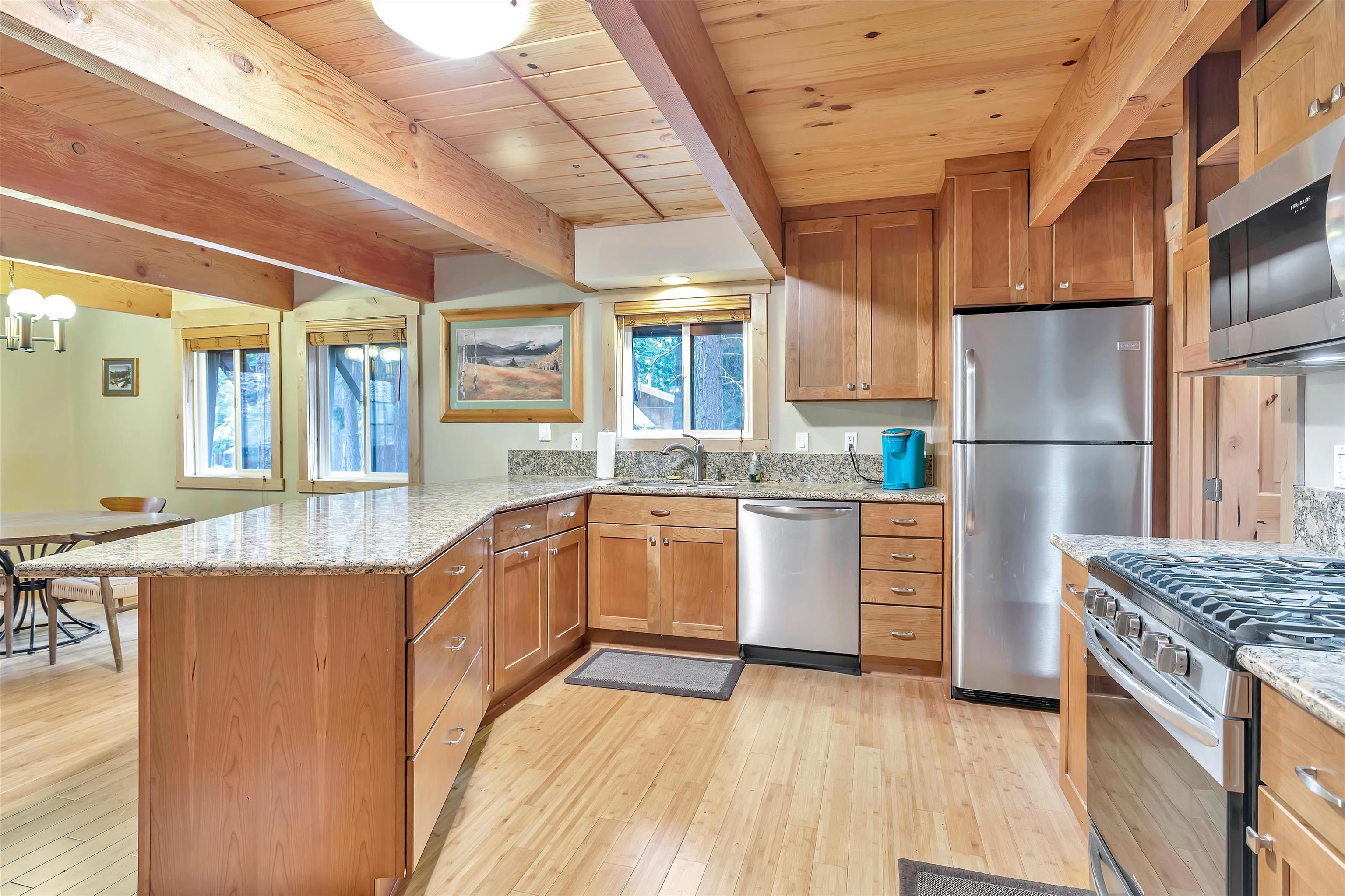 505 Granite Road Carnelian Bay, CA 96140 - Photo 7 of 20 a kitchen with refrigerator and cabinets