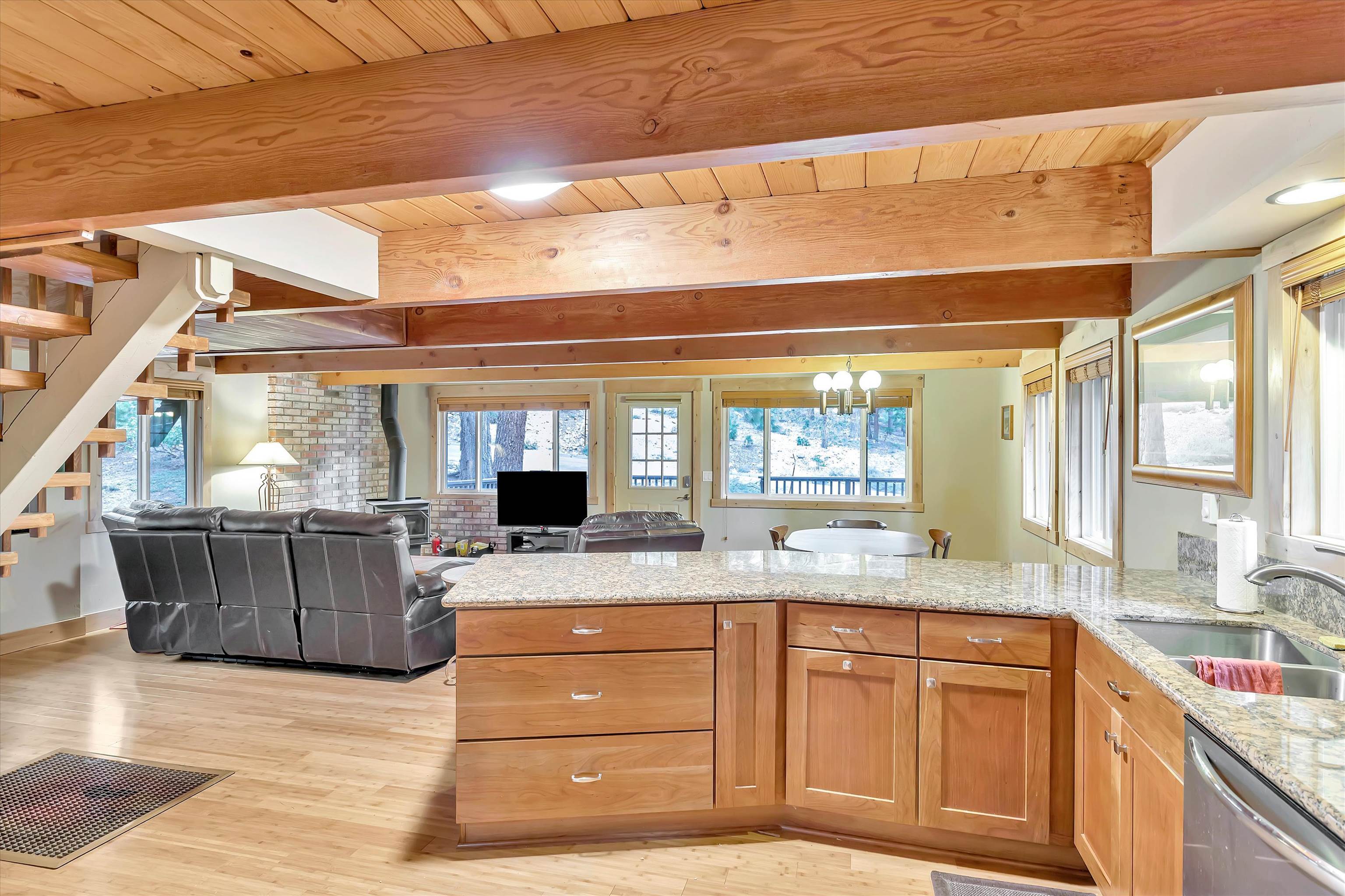 505 Granite Road Carnelian Bay, CA 96140 - Photo 9 of 20 a kitchen with a stove a sink and a wooden cabinets