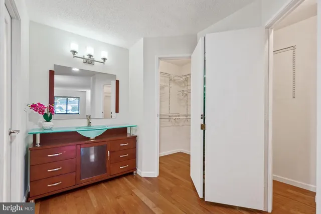 a view of a closet with storage