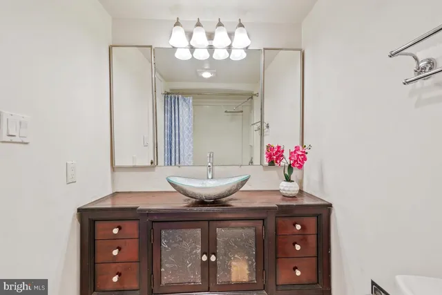 a view of a balcony with wooden floor and fence