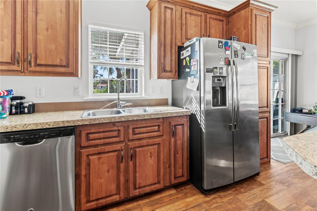 1 Meadow Circle Ellenton, FL 34222 - Photo 12 of 52 a kitchen with stainless steel appliances granite countertop a refrigerator and a sink