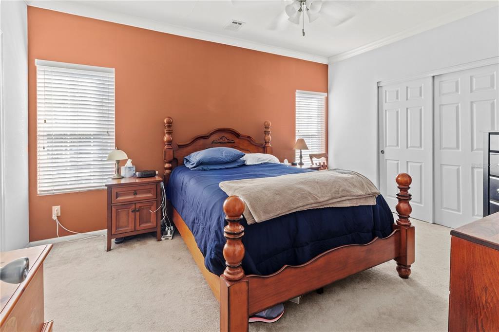 1 Meadow Circle Ellenton, FL 34222 - Photo 19 of 52 a bed sitting in a bedroom next to a window