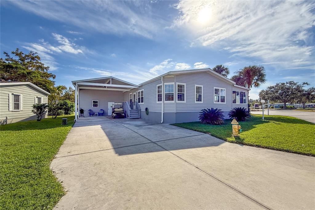 1 Meadow Circle Ellenton, FL 34222 - Photo 2 of 52 a front view of a house with a yard and garage