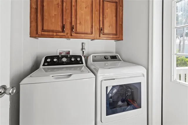 a bedroom with a bed and a flat screen tv in it
