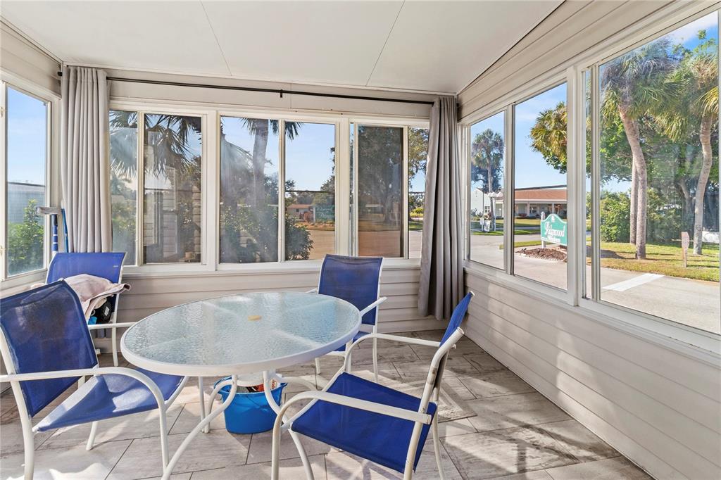 1 Meadow Circle Ellenton, FL 34222 - Photo 27 of 52 a dining room with furniture a chandelier and glass door
