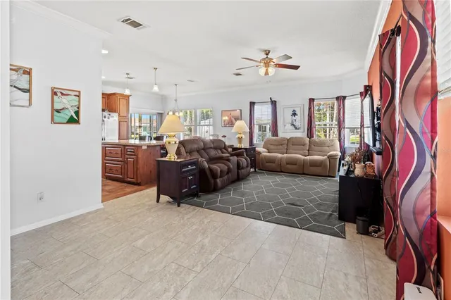a kitchen with stainless steel appliances granite countertop a stove refrigerator and a sink