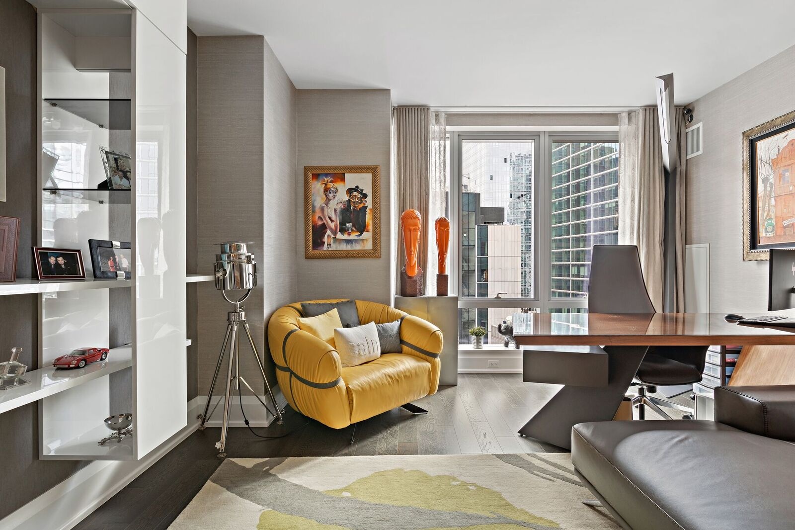 50 Riverside Boulevard, Unit 11H Manhattan, NY 10069 - Photo 5 of 37 a living room with furniture and a large window