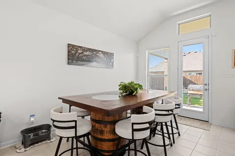 a view of a livingroom with furniture and stairs