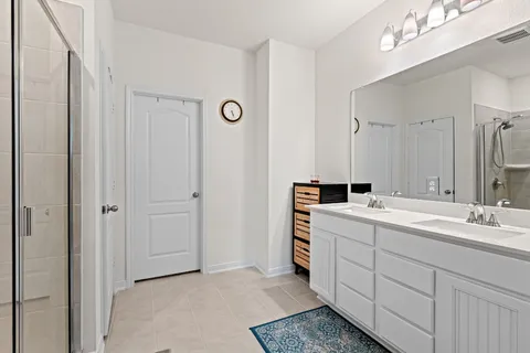 a bathroom with a sink toilet and a mirror