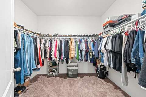 a dining room with furniture and a window