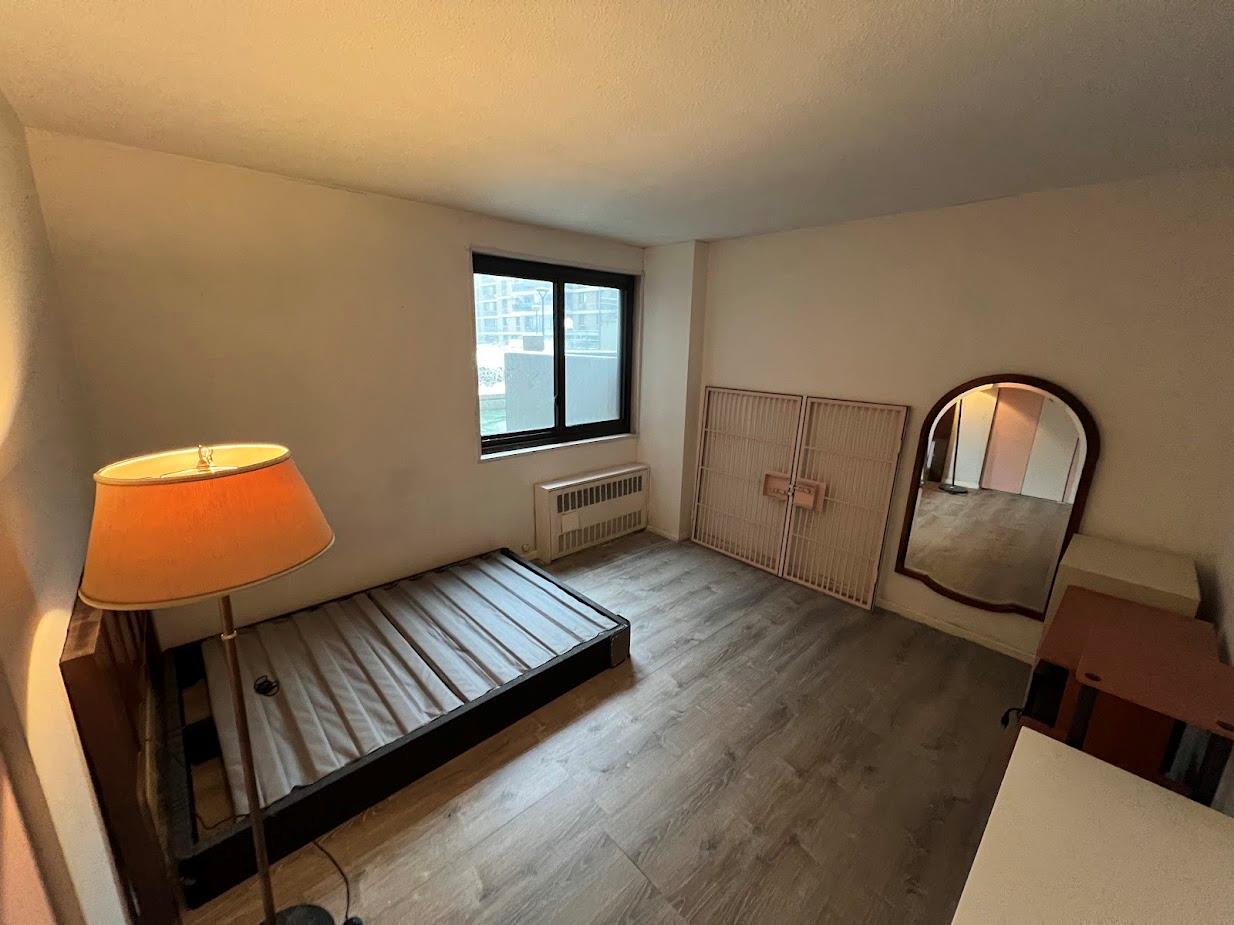 77 Fulton Street, Unit 2J Manhattan, NY 10038 - Photo 14 of 20 a view of an empty room window and wooden floor
