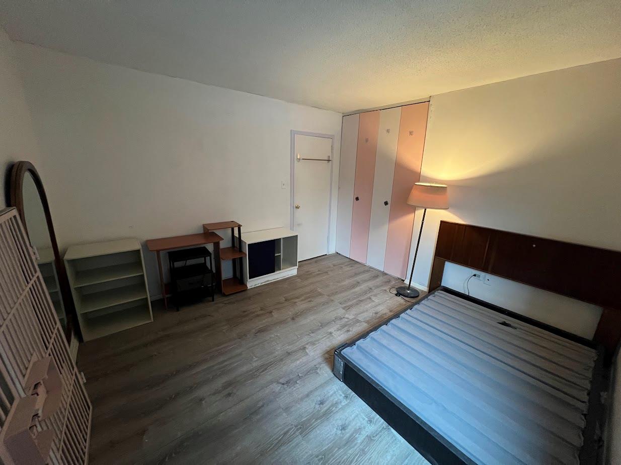 77 Fulton Street, Unit 2J Manhattan, NY 10038 - Photo 15 of 20 a view of a room with wooden floor and stairs