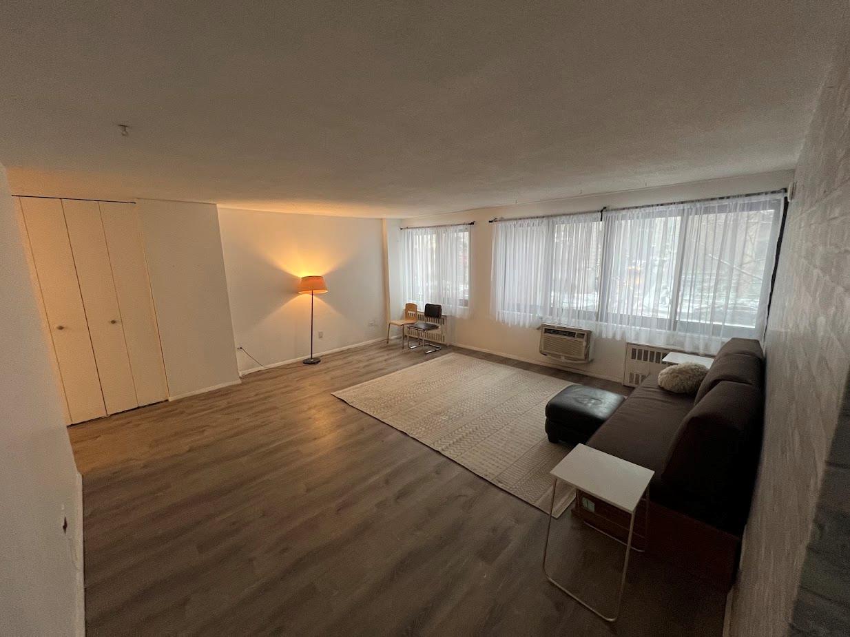 77 Fulton Street, Unit 2J Manhattan, NY 10038 - Photo 10 of 20 a living room with furniture