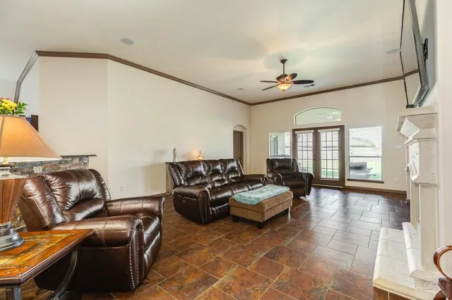 a kitchen with stainless steel appliances kitchen island granite countertop a refrigerator and stove