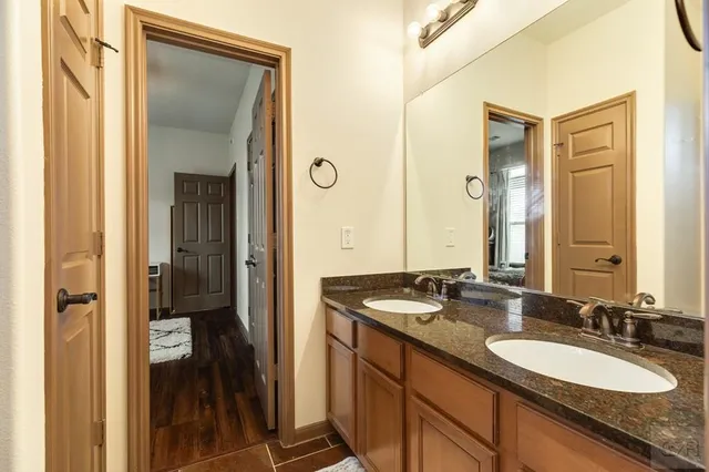 a bathroom with a granite countertop window and a shower