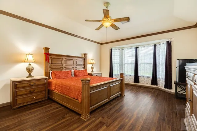 an aerial view of a house with a swimming pool