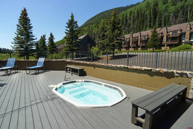 a view of a livingroom with furniture and windows