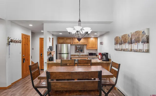 a view of dining room and kitchen island with furniture