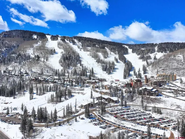 a view of a city with mountains in the background