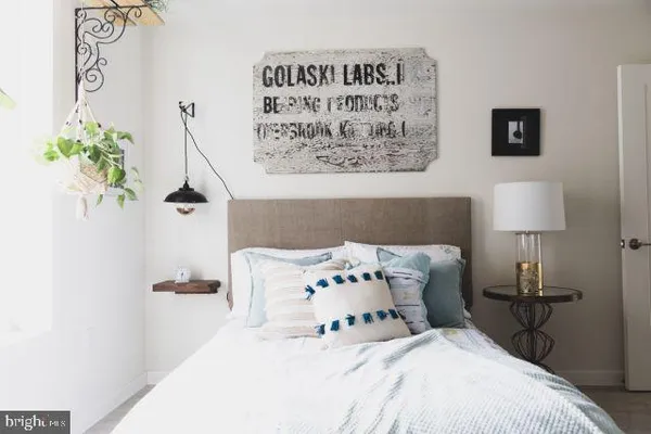 with chair and a lamp on a table