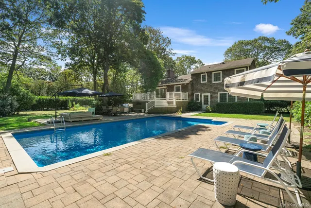 a view of swimming pool with lounge chair