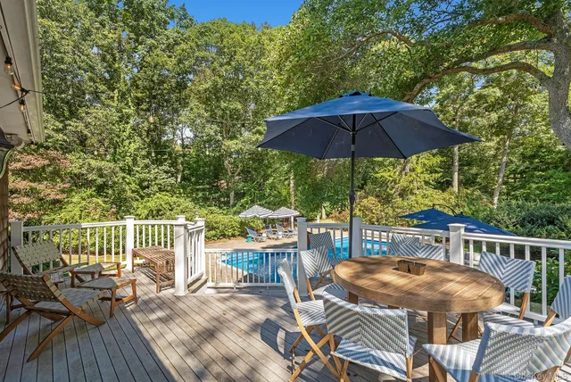 a view of balcony with outdoor seating and trees