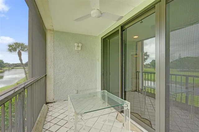a view of washer and dryer with bathroom in the background