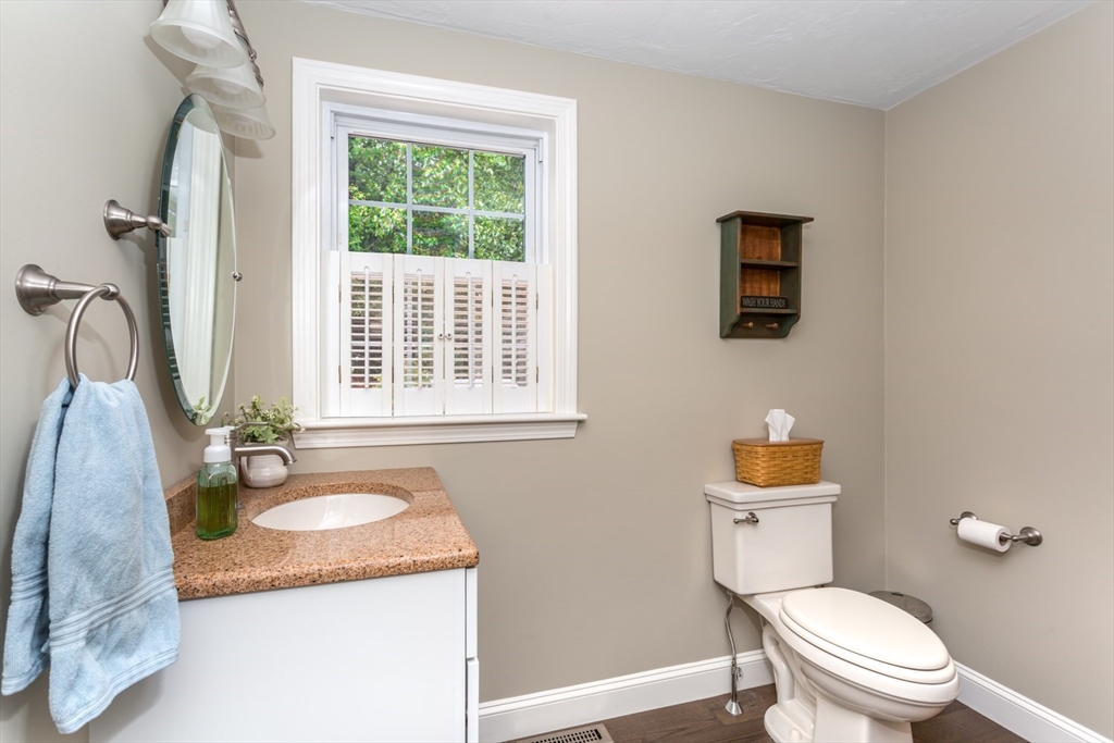 5 Wadsworth Farm Road Franklin, MA 02038 - Photo 14 of 42 a bathroom with a granite countertop sink toilet and a mirror