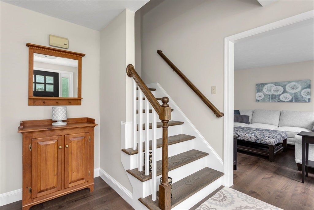 5 Wadsworth Farm Road Franklin, MA 02038 - Photo 17 of 42 a view of a livingroom with furniture and staircase