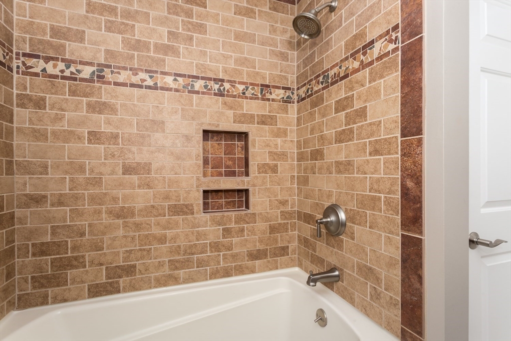 5 Wadsworth Farm Road Franklin, MA 02038 - Photo 24 of 42 a bathroom with a bathtub and a shower