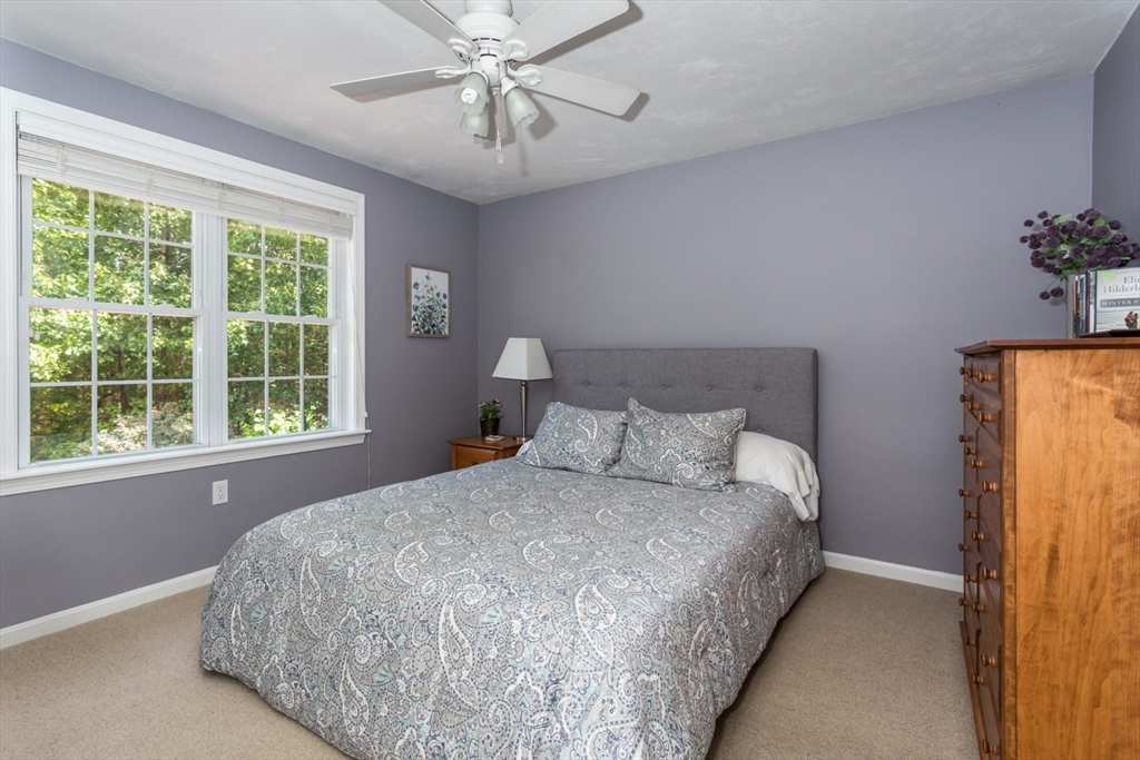 5 Wadsworth Farm Road Franklin, MA 02038 - Photo 25 of 42 a large bed sitting in a bedroom next to a window