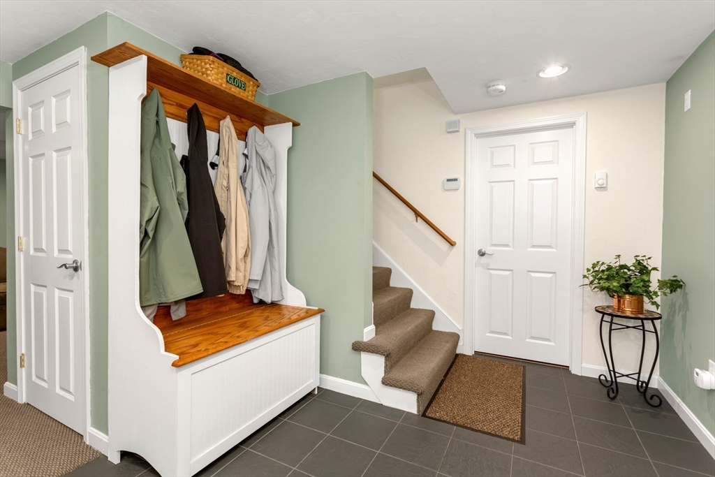 5 Wadsworth Farm Road Franklin, MA 02038 - Photo 26 of 42 a room with table and a potted plant