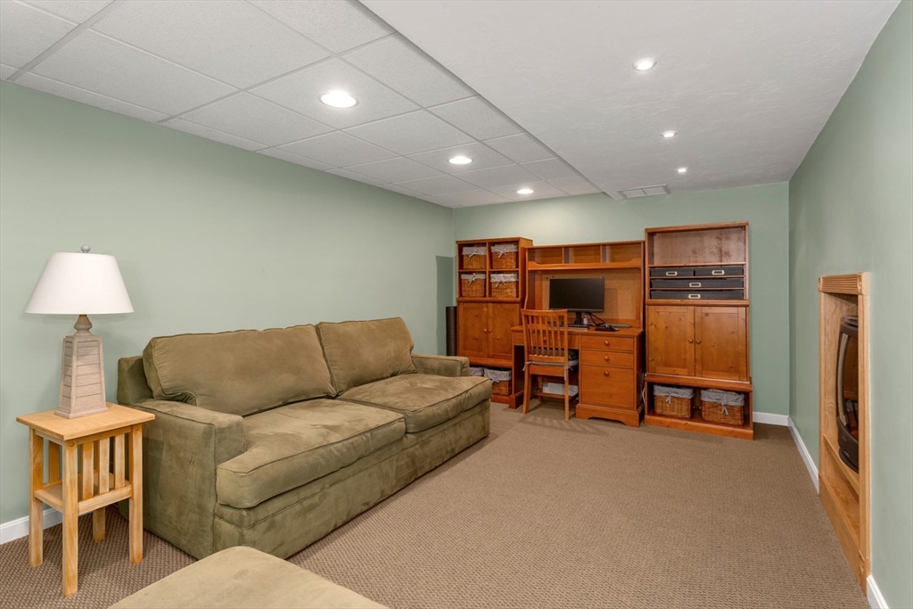 5 Wadsworth Farm Road Franklin, MA 02038 - Photo 27 of 42 a living room with furniture and a flat screen tv