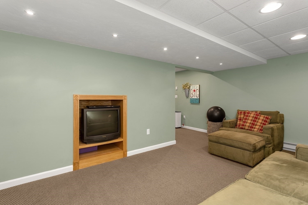 5 Wadsworth Farm Road Franklin, MA 02038 - Photo 28 of 42 a living room with furniture and a ceiling fan