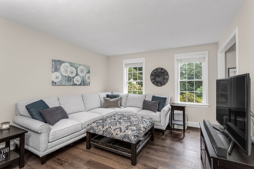 5 Wadsworth Farm Road Franklin, MA 02038 - Photo 5 of 42 a living room with furniture a window and a flat screen tv