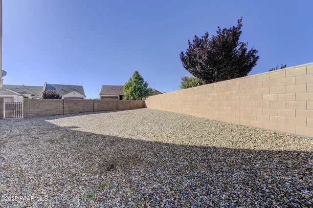 a view of a house with backyard and porch