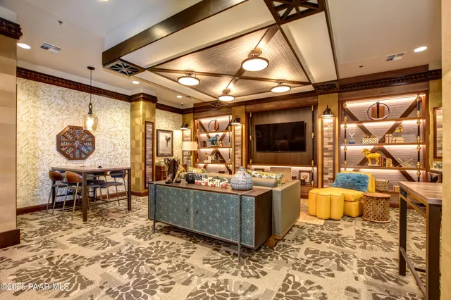 a swimming pool with outdoor seating and yard