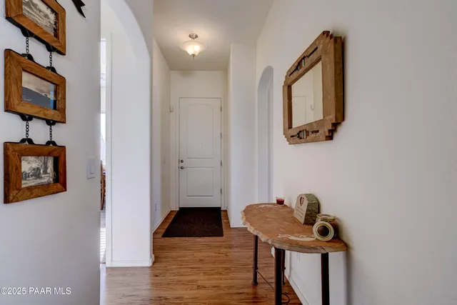 a view of a hallway with seating area