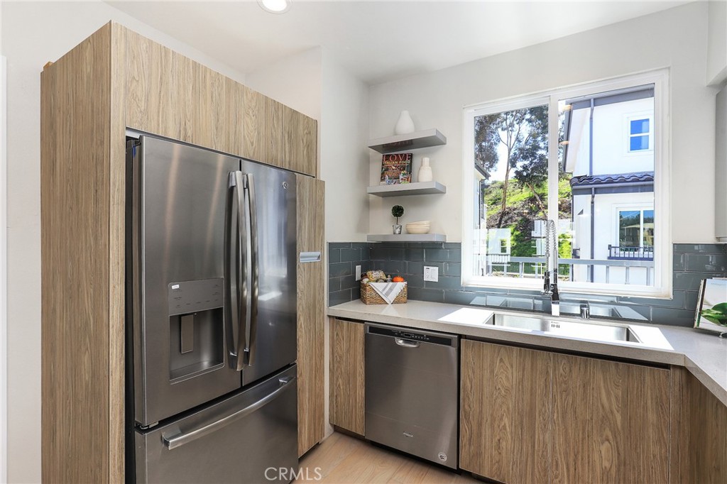 6 Bethpage Lane Phillips Ranch, CA 91766 - Photo 17 of 63 a kitchen with granite countertop a refrigerator and a sink