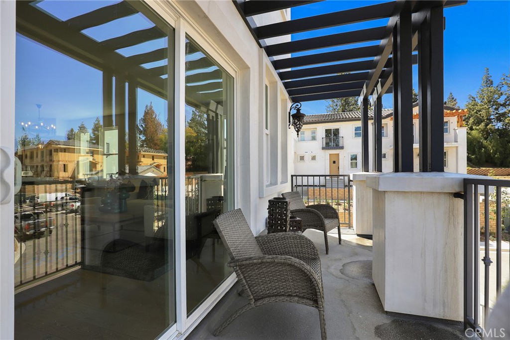 6 Bethpage Lane Phillips Ranch, CA 91766 - Photo 18 of 63 a balcony with furniture and a potted plant