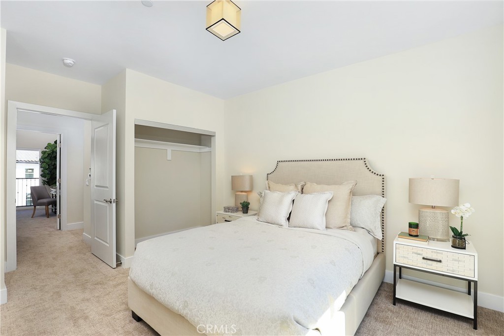 6 Bethpage Lane Phillips Ranch, CA 91766 - Photo 23 of 63 a bedroom with a bed and a chandelier