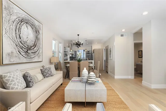 a kitchen with stainless steel appliances a refrigerator and a sink