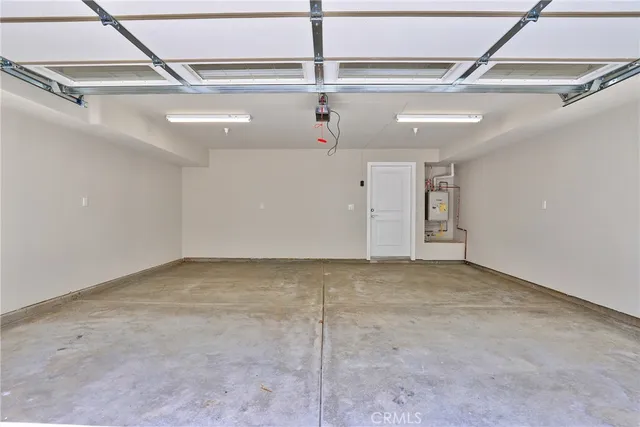 an outdoor space with patio and white umbrellas